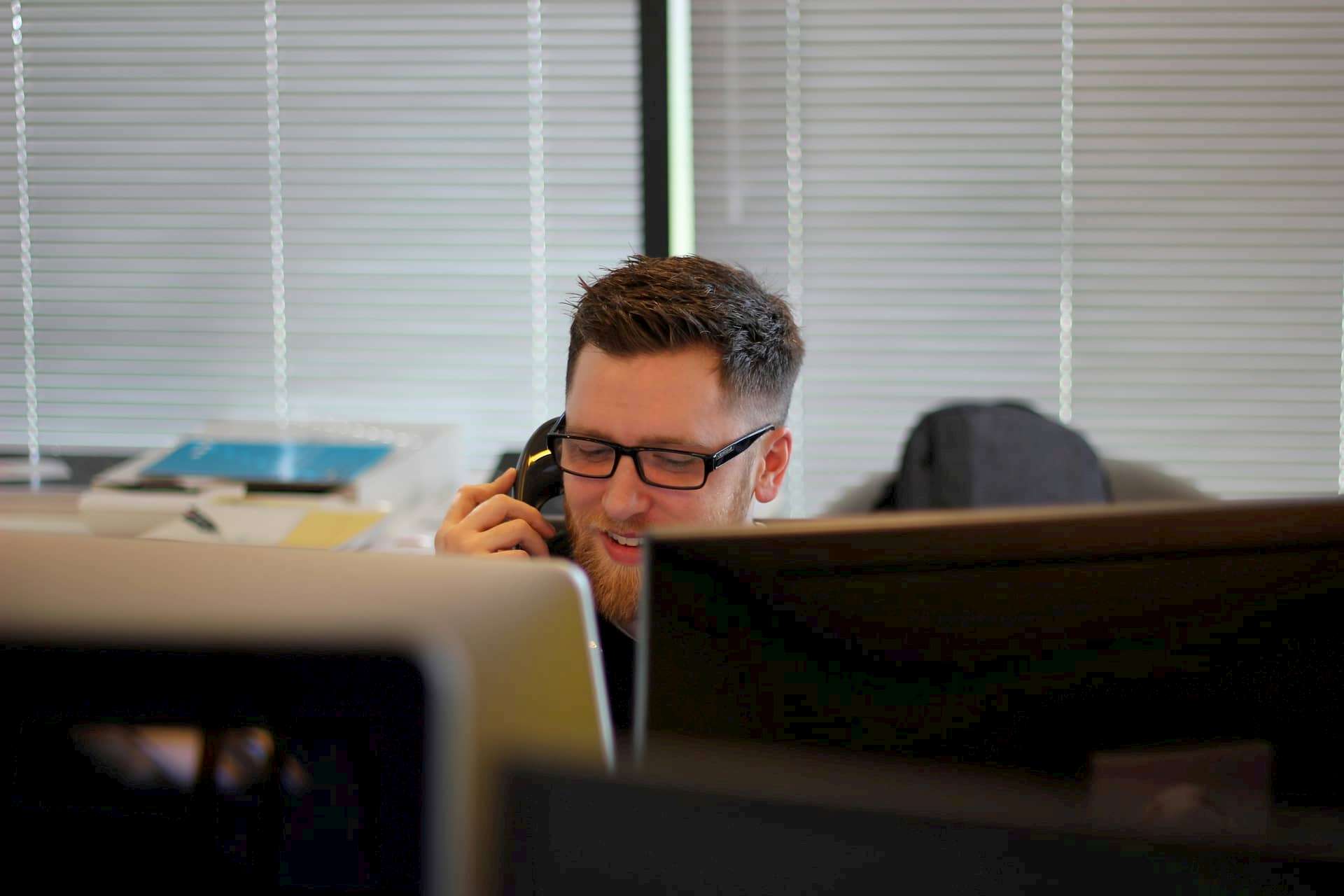 Man on phone smiling
